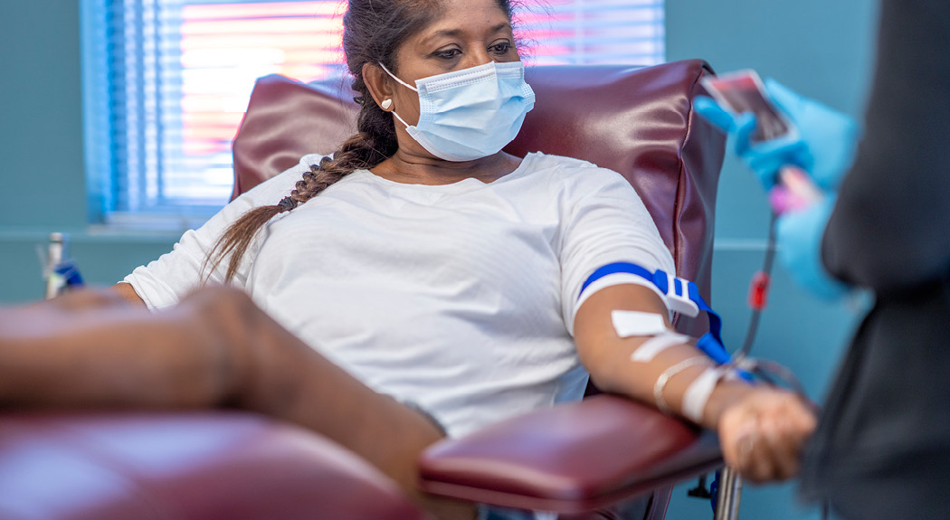 latina woman giving blood