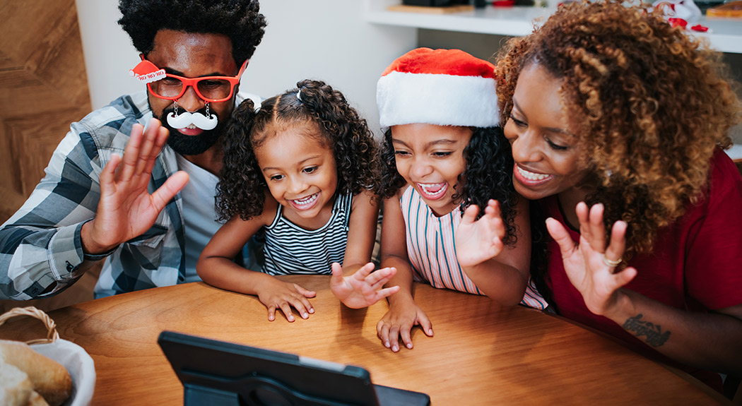 African-American family celebrating the holidays over Zoom