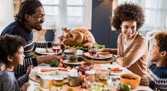 African-American family eating Thanksgiving dinner