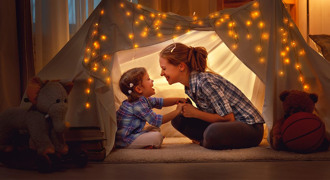 Mom and daughter in tent