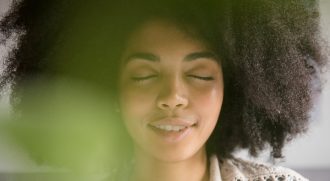 young African-American woman meditating