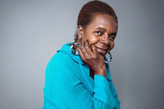 Older African-American lady with hand on her chin